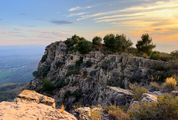 Mountains landscape on sunset. Mountain view from Mola De Segart mountain in Sierra Calderona national park in Valencia, Spain. Sunset over mountains. Landscape of a mountain valley. Hill on sunrise.