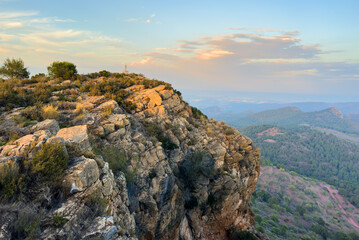 Mountains landscape on sunset. Mountain view from Mola De Segart mountain in Sierra Calderona national park in Valencia, Spain. Sunset over mountains. Landscape of a mountain valley. Hill on sunrise.