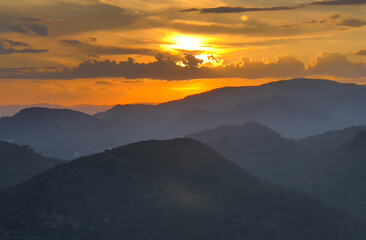 Mountains landscape on sunset. Mountain view from Mola De Segart mountain in Sierra Calderona national park in Valencia, Spain. Sunset over mountains. Landscape of a mountain valley. Hill on sunrise.