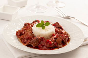 A delicious beef stew with rice and paprika sauce