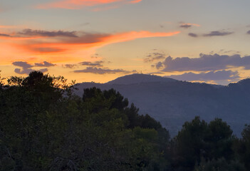 Mountains landscape on sunset. Mountain view from Mola De Segart mountain in Sierra Calderona national park in Valencia, Spain. Sunset over mountains. Landscape of a mountain valley. Hill on sunrise.