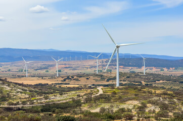 Wind turbine in mountains landscape. Eolic park windpower. Wind farm or New Wind green energy. Wind...