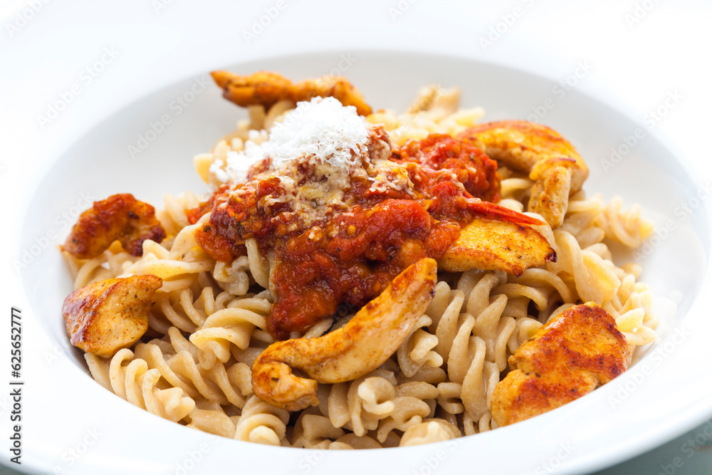 Wall mural pasta fusilli with spicy chicken meat and tomato sauce