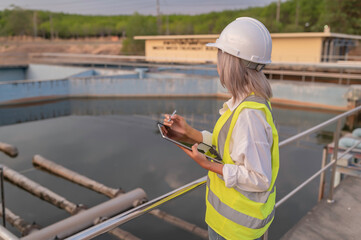 Environmental engineers work at wastewater treatment plants,Water supply engineering working at...