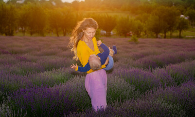 Mother and her baby in the lavender field .