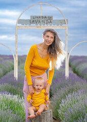 Mother and her baby in the lavender field .