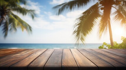 View over a wooden pier in the foreground to the sea with palm trees in the background