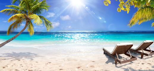 Tropical Beach - Deckchairs With Palm Tree On Coral Sand In Maldives Island - Glittering Light Effects With Selective Focus In Foreground