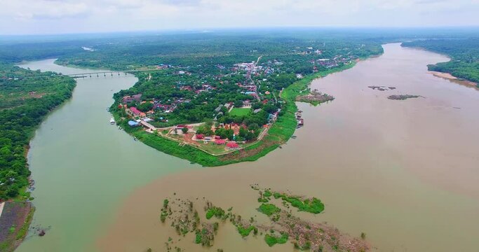 Aerial view amazing two colors in two rivers at three junctions in Khong Chiam Ubon Ratchathani Thailand..Mekong river the border between Thai and Lao..islands in the middle of Kong river background.