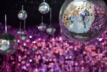 Mirror shiny ball on a pink background. Disco ball