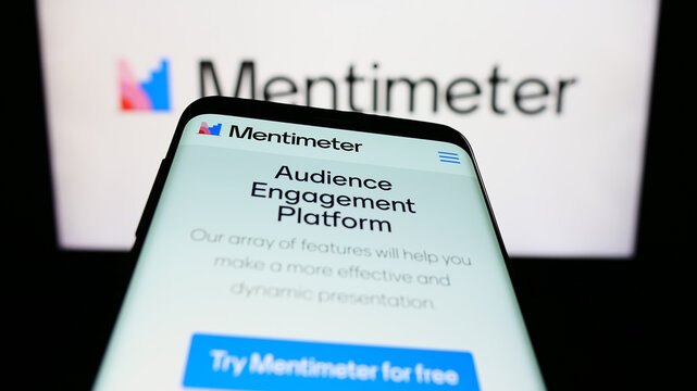 Stuttgart, Germany - 07-09-2023: Mobile phone with website of presentation software company Mentimeter on screen in front of business logo. Focus on top-left of phone display.