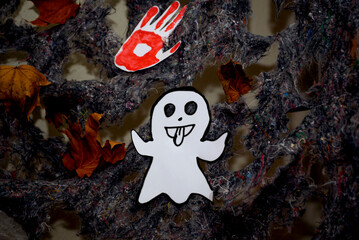 Decoration made by children for Halloween. Funny white ghost.