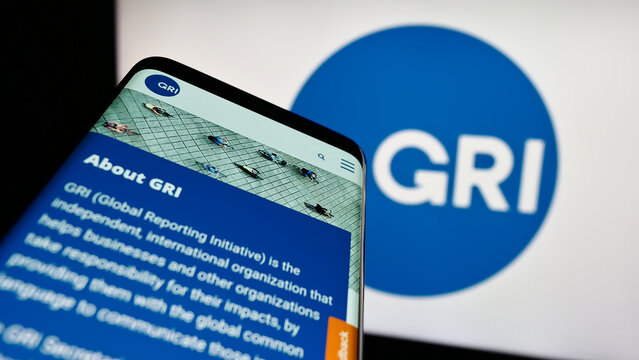 Stuttgart, Germany - 07-11-2023: Mobile phone with website of the Global Reporting Initiative (GRI) on screen in front of logo. Focus on top-left of phone display.