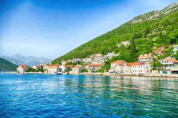 Fototapeta na wymiar Mountains drop down to the sea in the Bay of Kotor