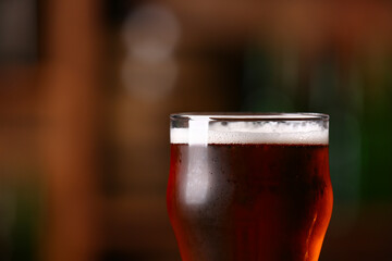 Glass of beer in bar, closeup. Oktoberfest celebration