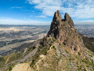 Scenic rock formation and viewpoint Muela del Diablo, the Devil´s tooth, overlooking the highest capital and vibrant city La Paz and El Alto, Bolivia