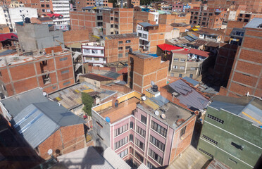 La Paz, the highest administrative capital and vibrant city in Bolivia viewed from the red cable car / teleferico from the center to El Alto market