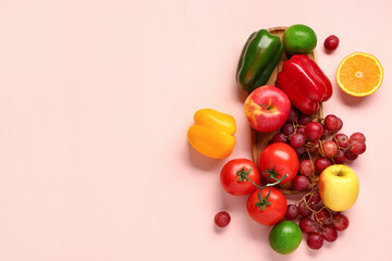 Naklejka na ściany i meble Fruits and vegetables on beige background. Healthy food concept