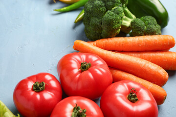 Different fresh vegetables on blue background