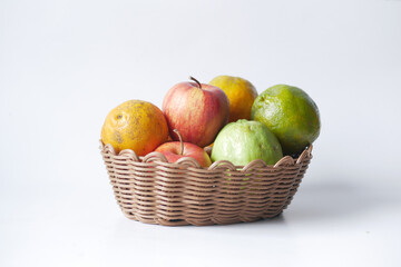 mixed fruits in a basket on table 