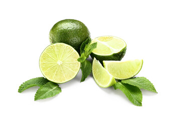 Fresh limes and mint leaves isolated on white background