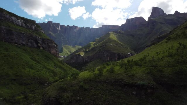 Drone shot of the landscapes surrounding the natural amphitheatre in the Drakensberg mountain range of South Africa.