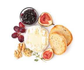 Tasty baked Camembert cheese with bread, jam, figs and grapes on white background