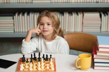 Early development. Child thinking about chess. The concept of learning and growing children. Chess,...