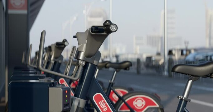 Close-up of Row of Green bicycles for rent. Electric bicycle charging station. Shared electric bikes parked on city street