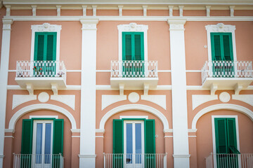 facade of a building, pink and green, monopoli, puglia, italy, bari, south italy