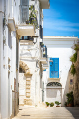 street in old town of monopoli, white facades, puglia, italy, bari, 