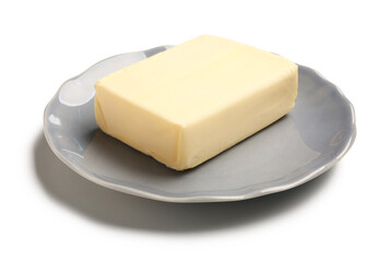Plate with fresh butter on white background