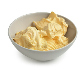 Bowl with fresh butter on white background