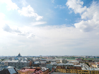 Fototapeta na wymiar Aerial, up view of the Nevski street and Cathedral of the Resurrection of Christ next to House of the Singer company in the historical city of St.Petersburg at sunny summer afternoon