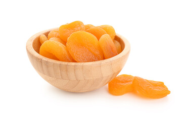 Wooden bowl with tasty dried apricots on white background