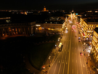 Aerial along the building view of the bright Nevski street and Kazan Cathedral and House of the Singer company in the historical city of the St. Petersburg at midnight