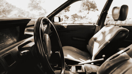 interior of an old car in black and white, sephia colors