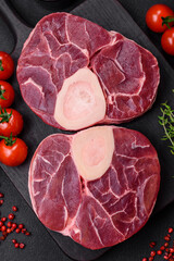 Fresh raw beef steak with bone or ossobuco with salt, spices and herbs