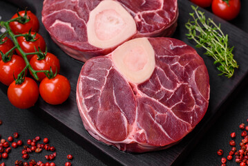 Fresh raw beef steak with bone or ossobuco with salt, spices and herbs