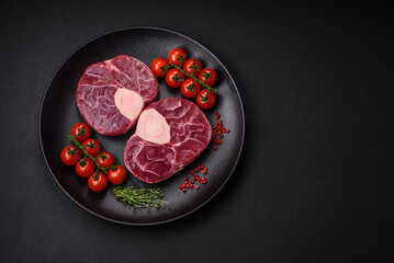Fresh raw beef steak with bone or ossobuco with salt, spices and herbs