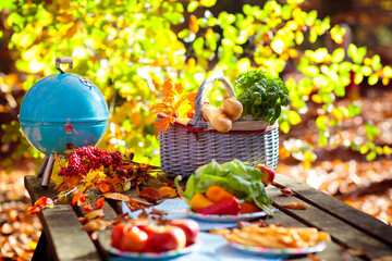 Picnic in autumn park. Family fall barbeque party.