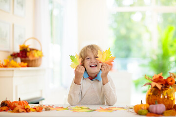 Autumn home decoration. Family decorating house.