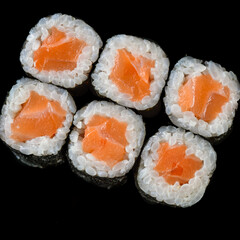 salmon maki on black background for online restaurant menu