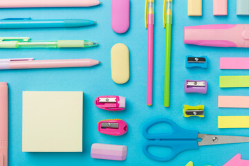 Flat lay with colorful school stationery on color backgroung, top view