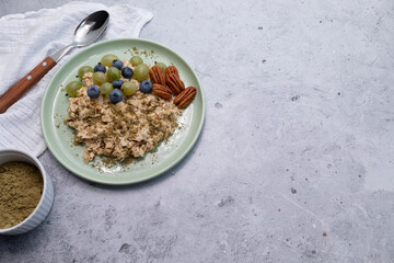 Top View Oatmeal Porridge With Hemp Protein Powder, Nuts, Berries, Bowl With Plant-derived Protein From Cannabis Plant, Spoon. Copy Space. Healthy Breakfast, Meal. Superfood. Horizontal Plane