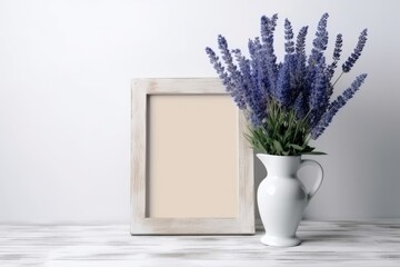 Mockup with summer blue flowers in a vase and a white frame on a light background.