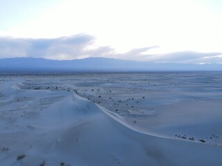 Desert Dreams: Aerial Views of a Twilight Stroll Amid the Taton Dunes in Fiambalá, Catamarca, Argentina