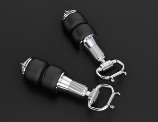 Two air suspension units on black background. 3D rendering image.