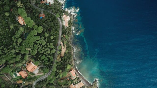 Aerial drone view top down coastline, beaches and houses of the island Elba, Italy