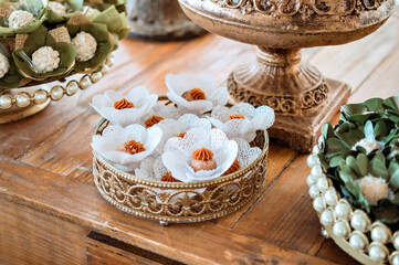 a tray of sweets decorated for wedding